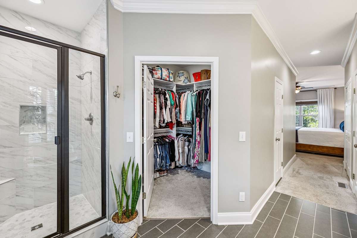 Walk in closet with a second closet