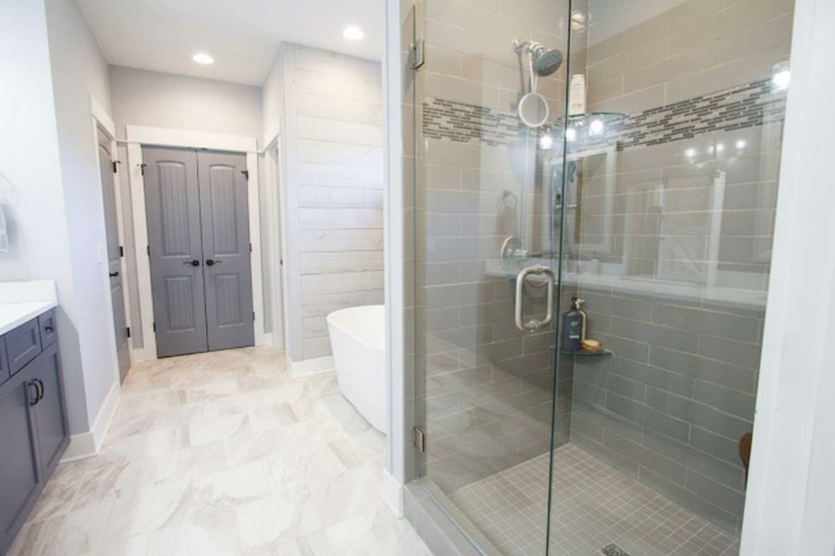 Primary Bath with Quartz countertops, separate shower and tub.