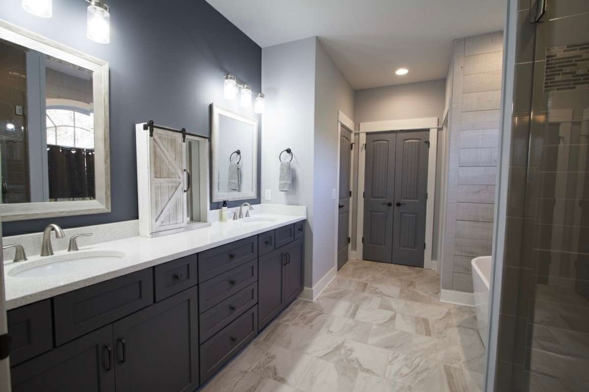 Primary Bath with double sinks and Quartz countertops.