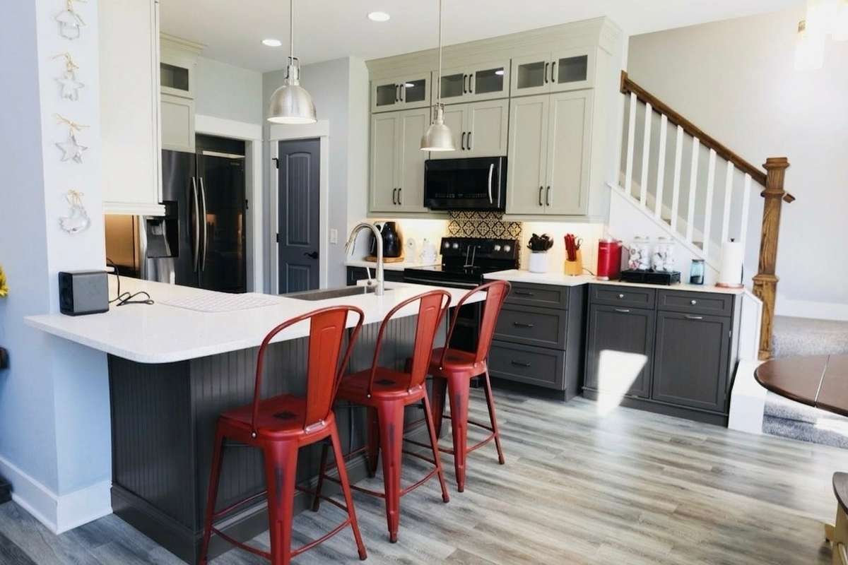 Kitchen with stainless steel appliances. Stove bought in 2026. Quartz countertops.