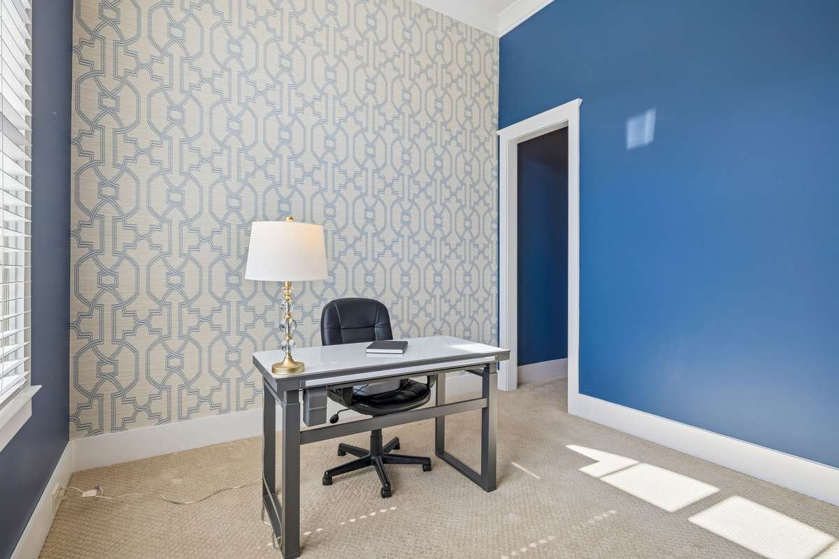 Bedroom 4 upstairs (current owners using as home office) with walk-in closets and full bath