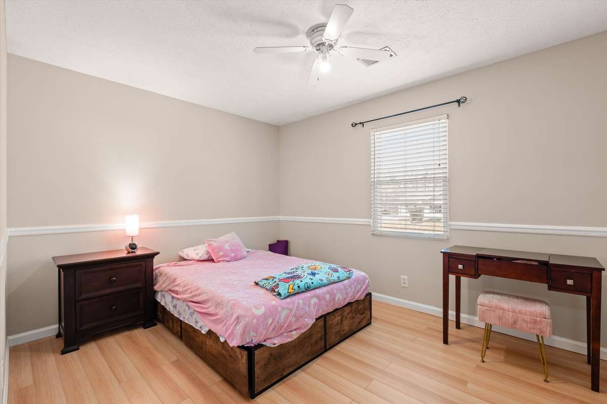 Second bedroom with fresh neutral paint