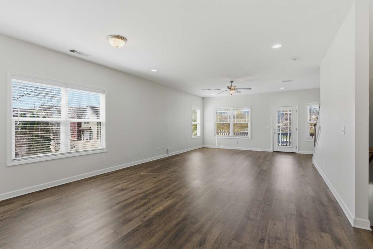 Large open living area flowing into the kitchen, ideal for everyday living and entertaining.