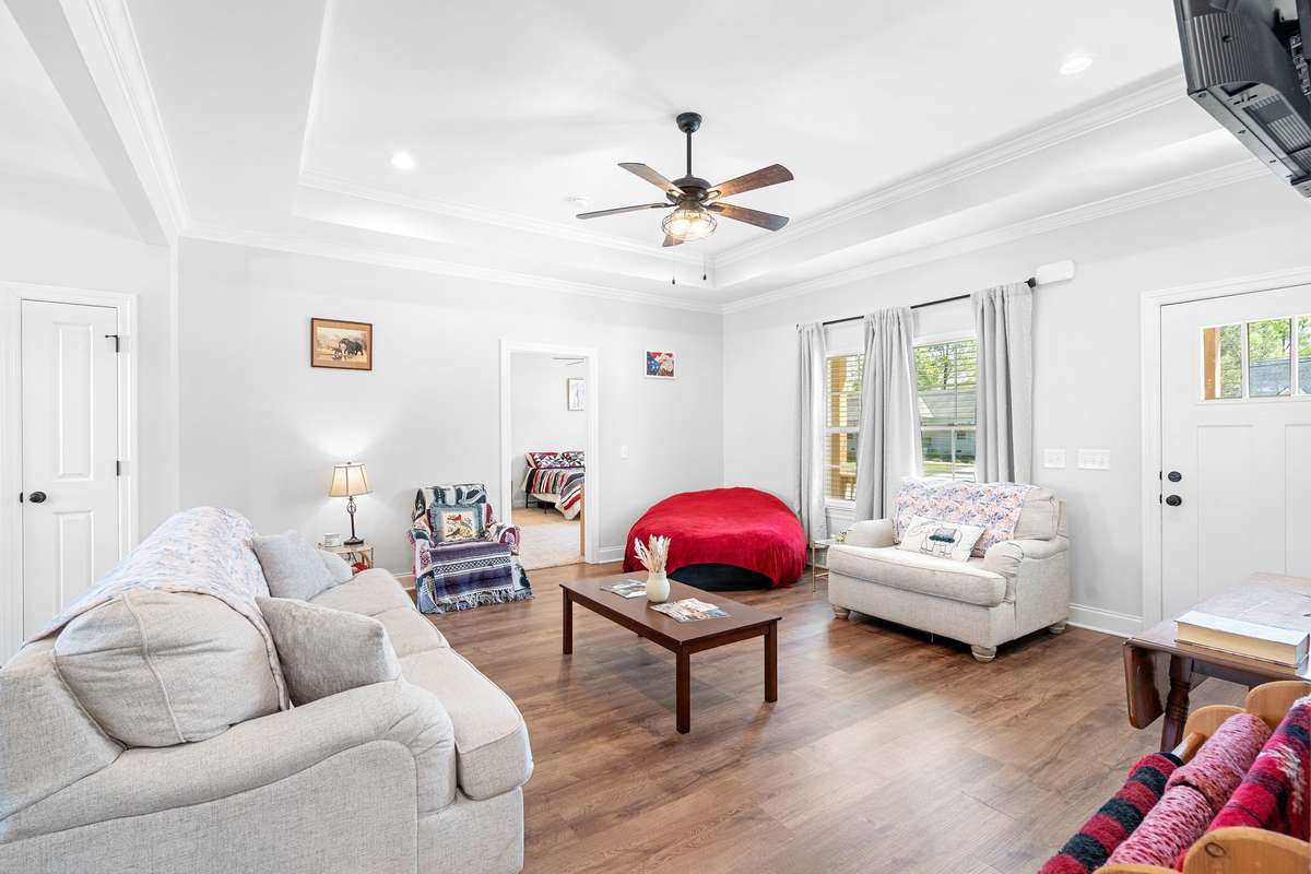 Laminate flooring in living room, dining, kitchen, bathrooms, and laundry rooms.