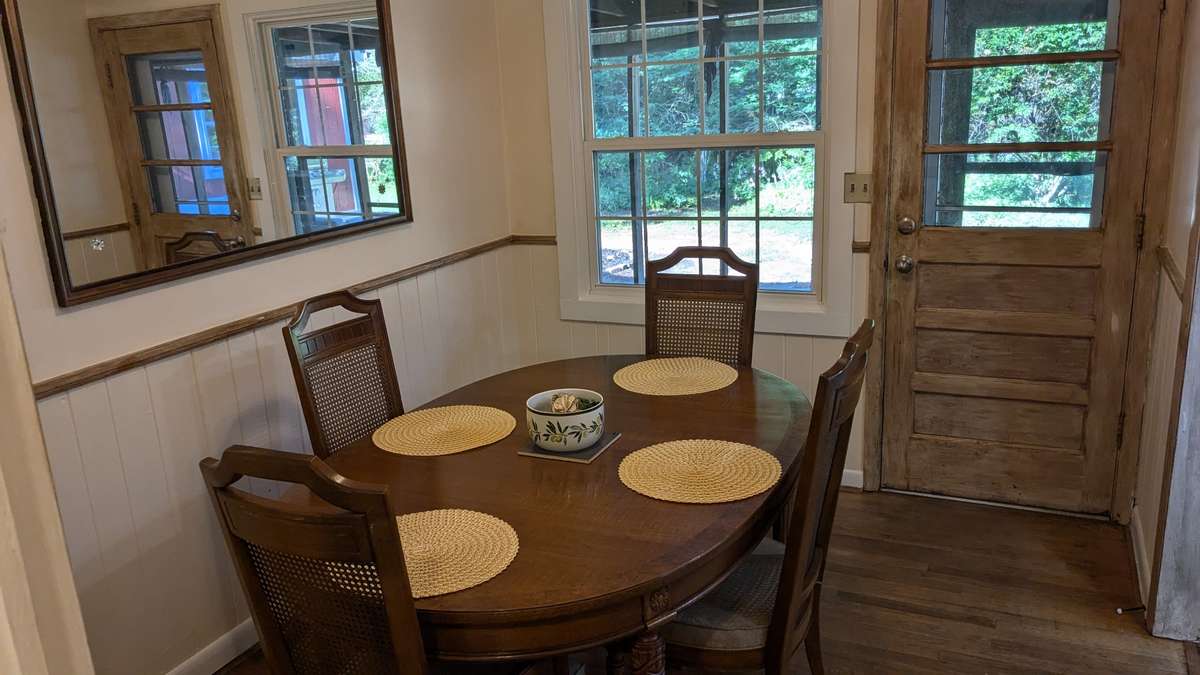 ...the dining room, with access to your wide screen-in back porch.