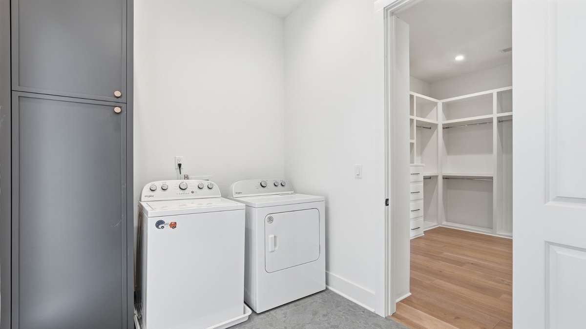 Laundry room attached to primary closet and upstairs hall, accessible for all parties
