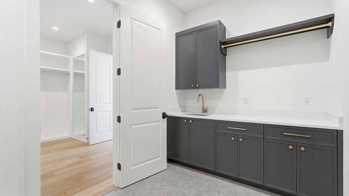 Laundry room attached to primary closet and upstairs hall, accessible for all parties
