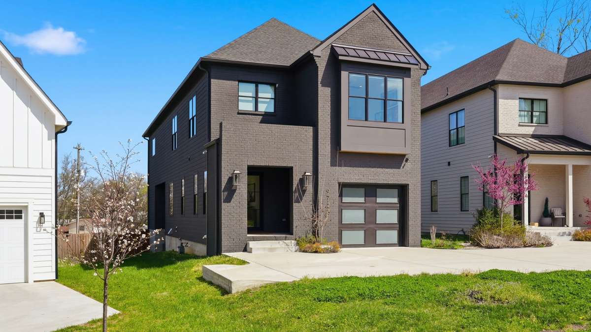Front of home view with beautiful houses to both sides of you