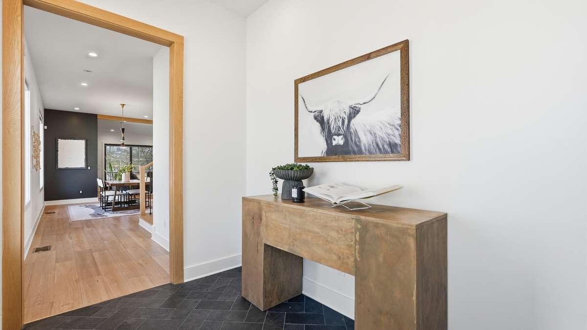Spacious entryway with stone tile