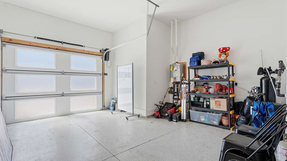 Front garage with finished epoxy floors