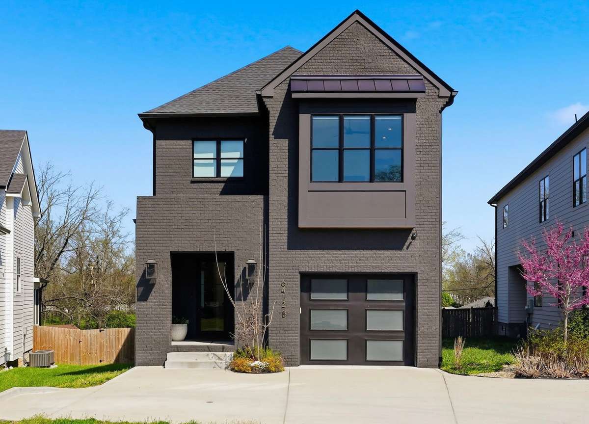 Front of home view with beautiful houses to both sides of you