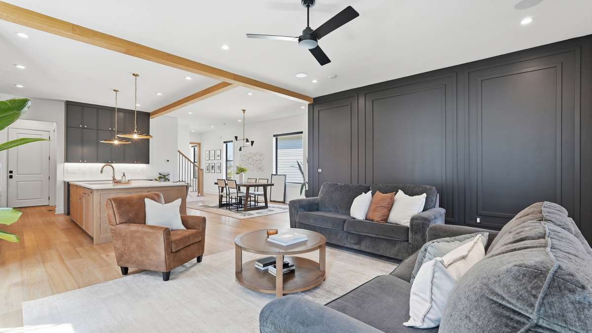Sleek and well lit accent wall with elevated trim lines