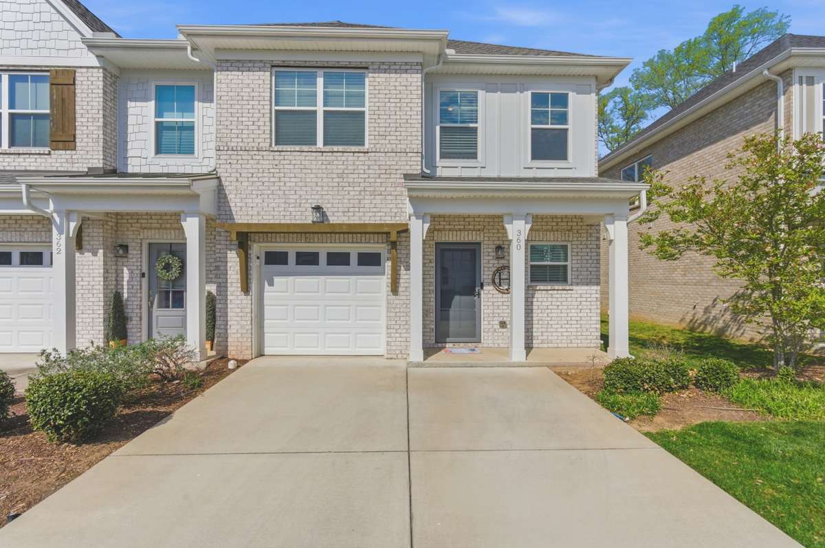 Beautiful end unit with an extra large driveway
