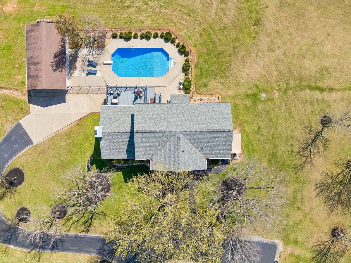 Expansive 17-acre setting provides complete privacy with the inground pool and outdoor entertaining spaces positioned to take advantage of the wooded surroundings.
