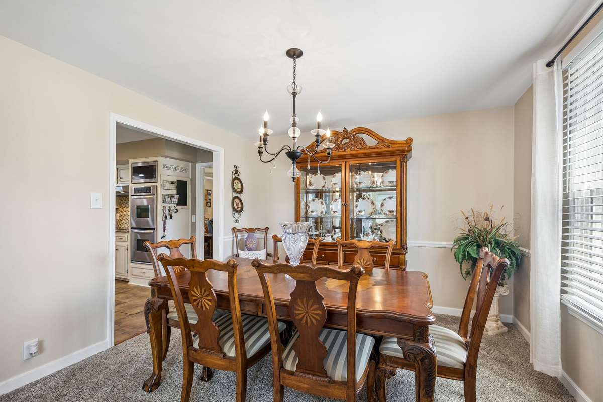 Formal dining room creates a traditional setting for holiday meals and special occasions.