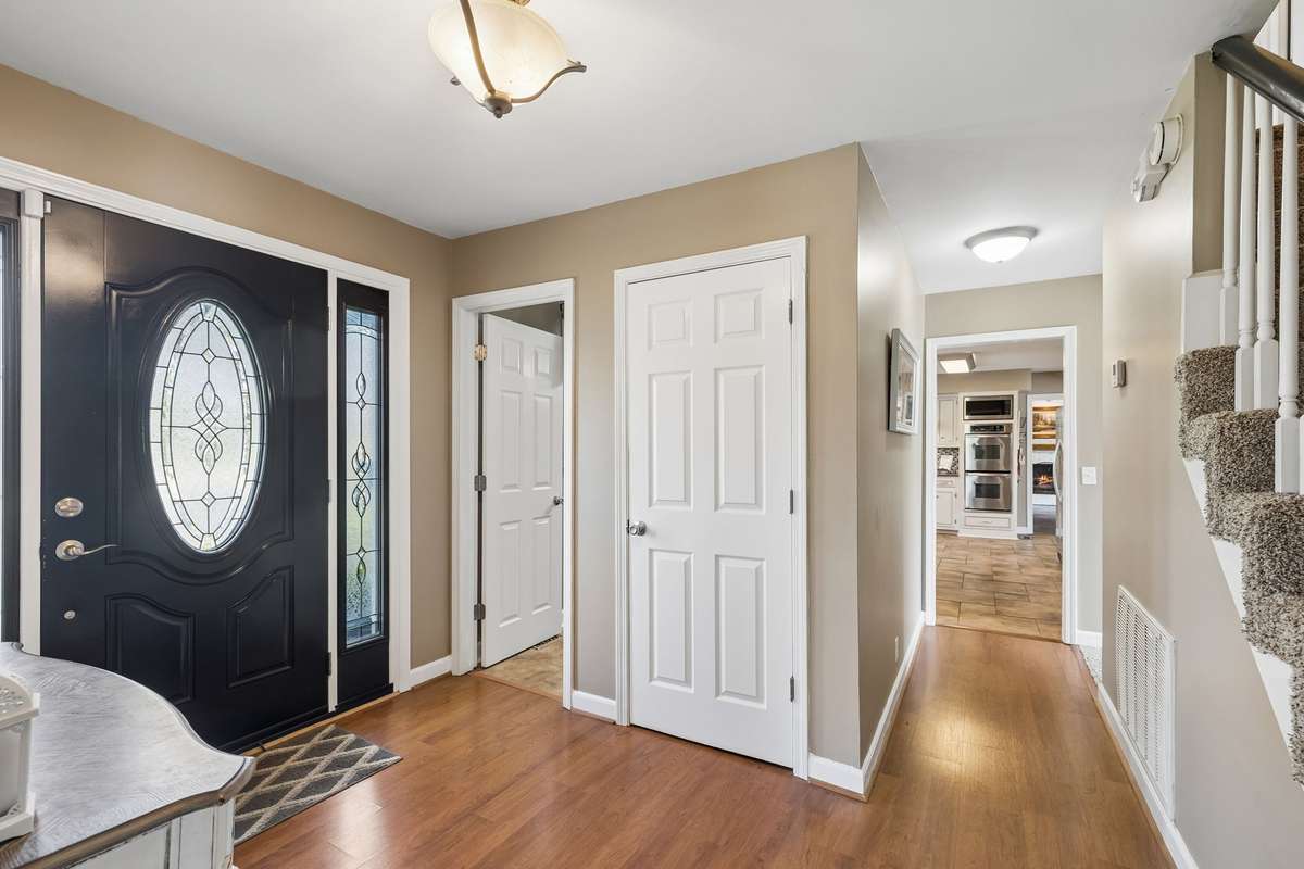 Foyer opens up with sight lines straight through to the kitchen and enough room to drop bags and keys without blocking the flow.