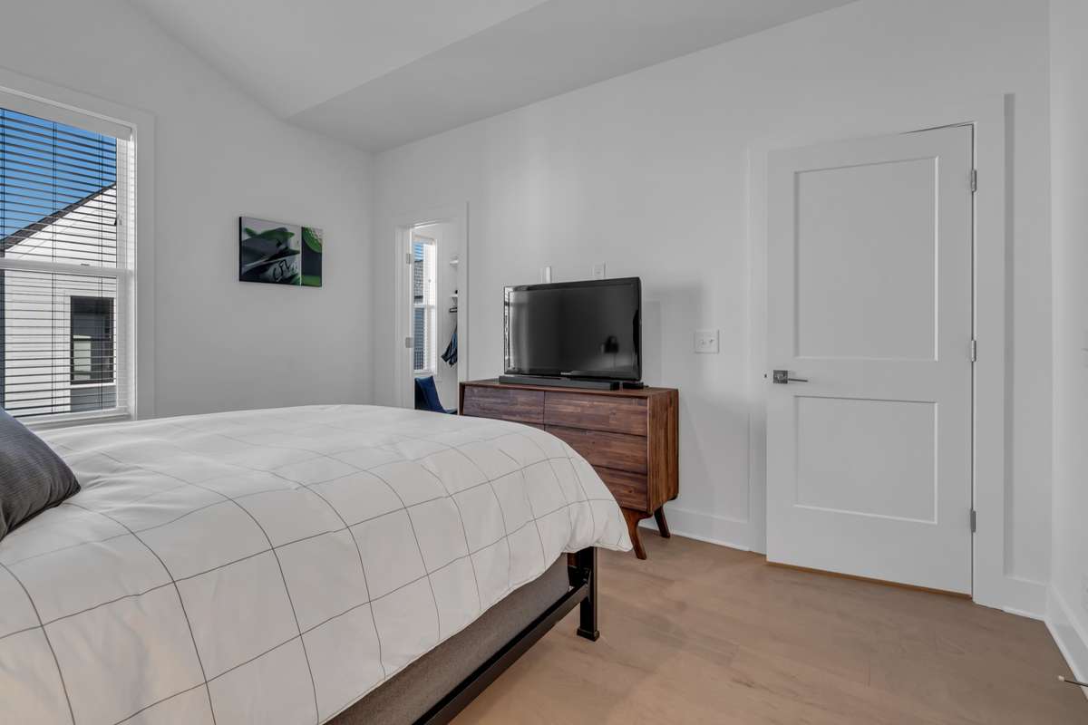 The primary has plenty of natural light as well as an ensuite and walk-in closet.