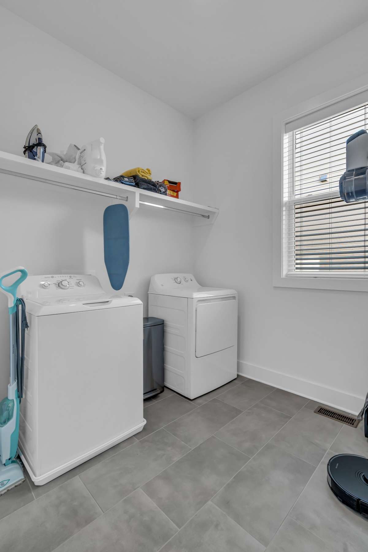 The large, dedicated laundry space off of the kitchen is perfect for all of your cleaning supplies and functions as a utility closet as well.