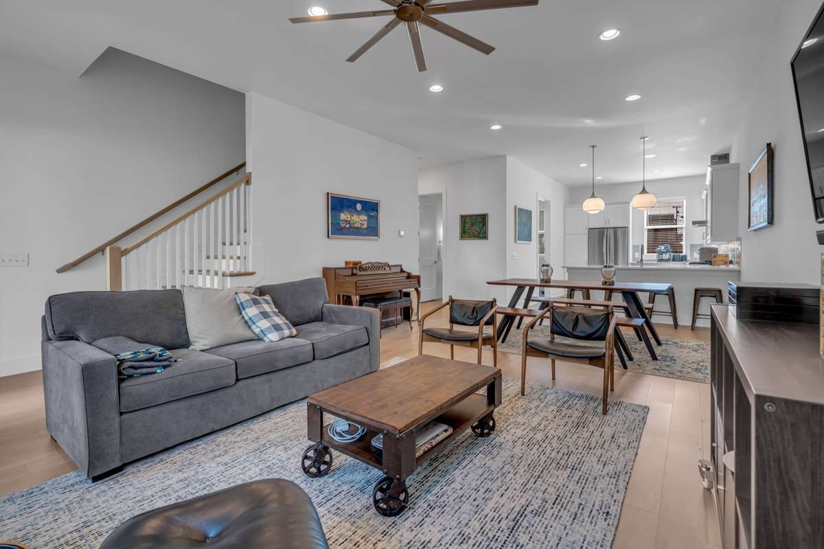 Up the first flight of stairs is the open concept living, dining, and kitchen,