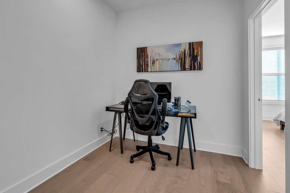 At the top of the stairs to the third level is a nook that could be used as an open office space, reading nook, art display, etc.