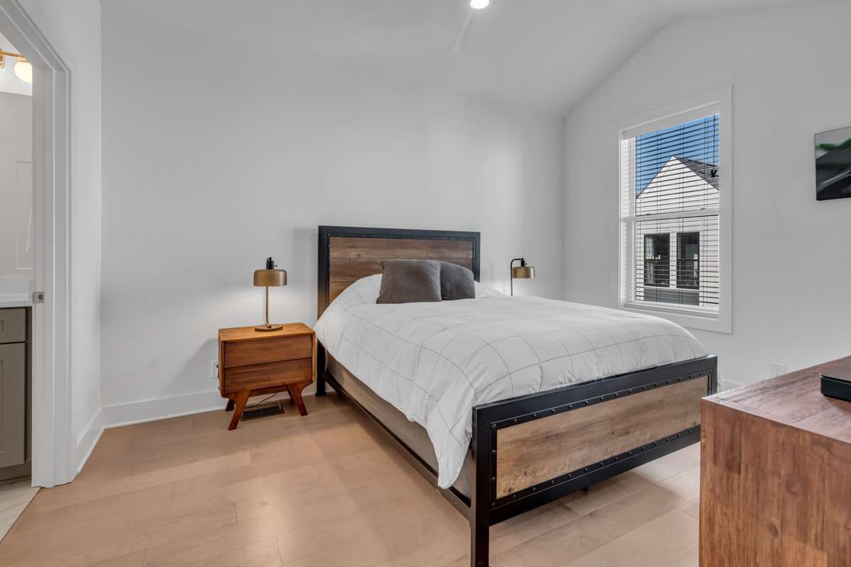 The primary bedroom has vaulted ceilings and lives large!