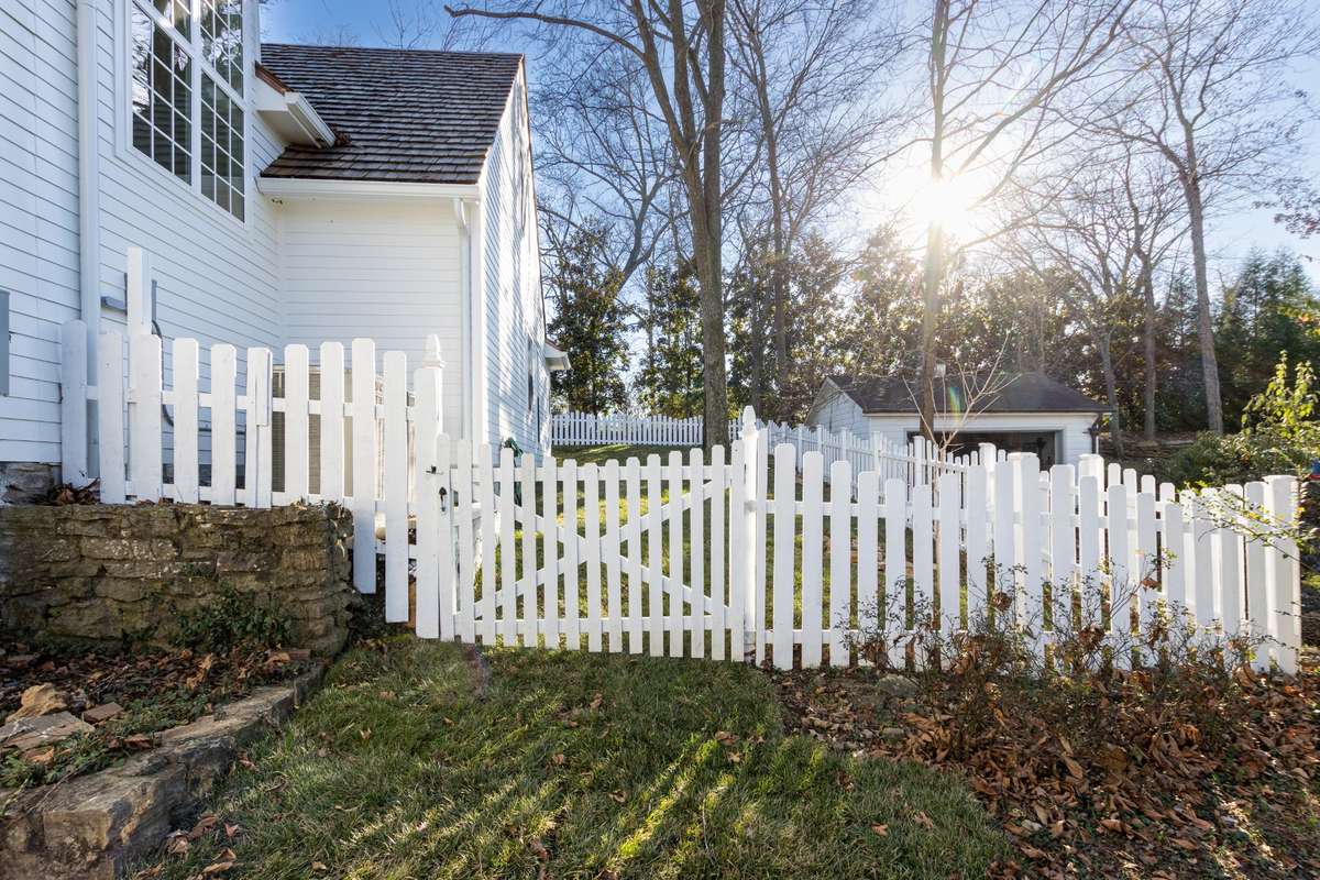 Enjoy the dogs being in the back with a picket fence.