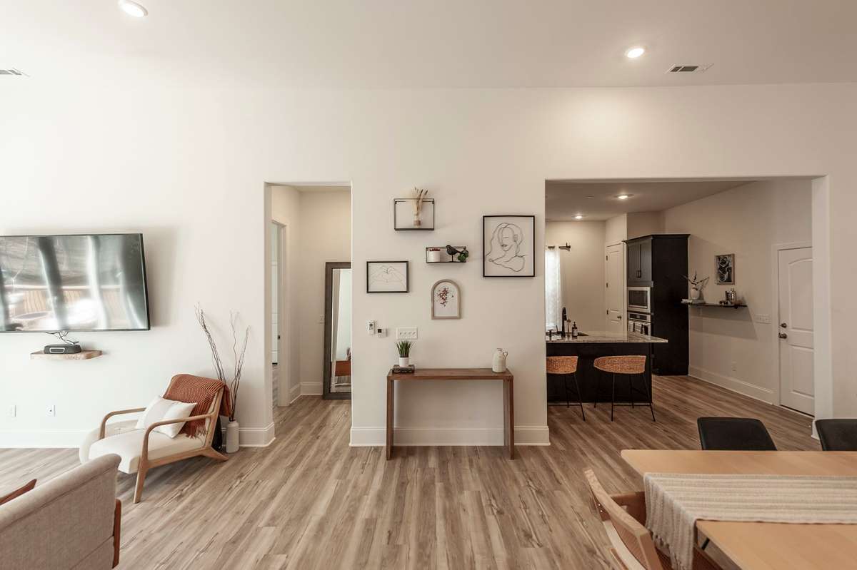 There is a laundry room located in the hallway perfectly between the great room and primary suite.