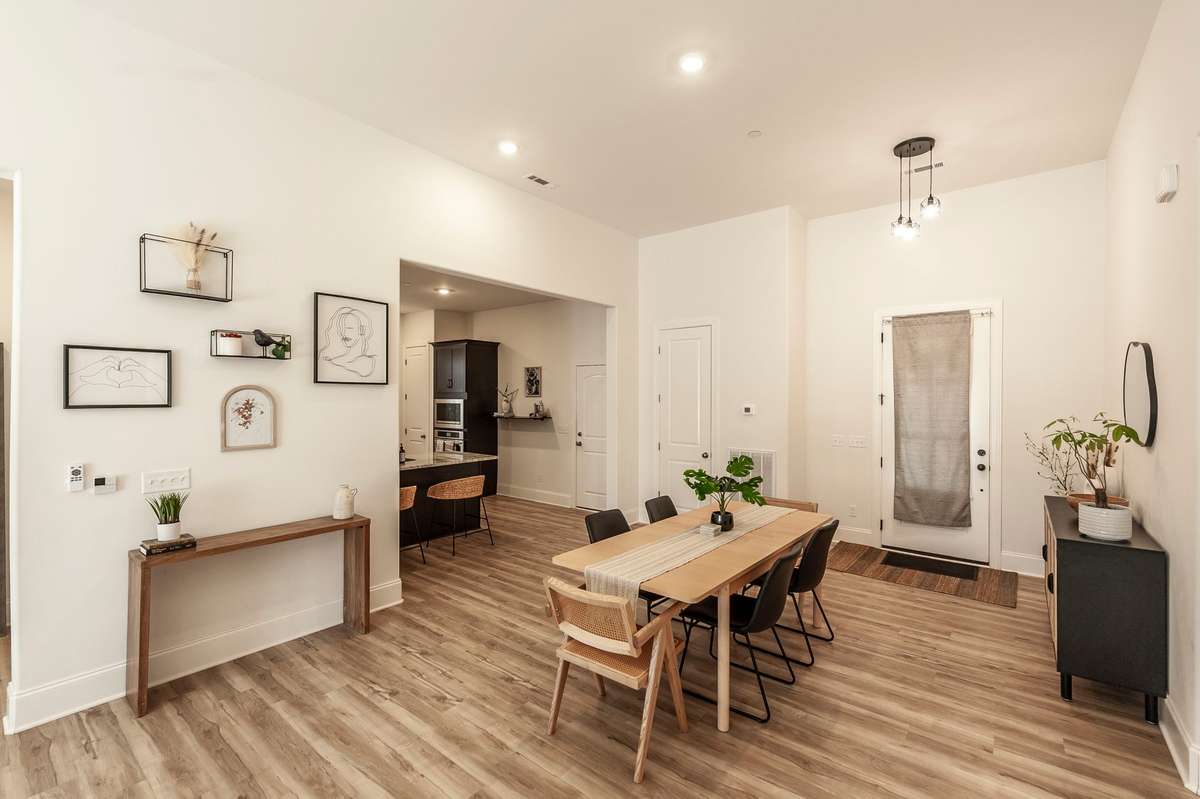 The great room features plenty of space for a large dining table just off the kitchen that flows seamlessly to the living area.