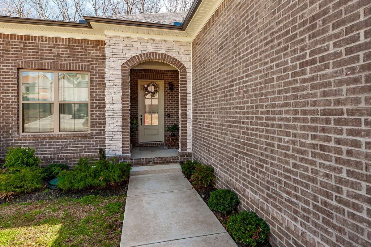 Notice the extra stonework around the porch, a beautiful upgrade from the standard entry!