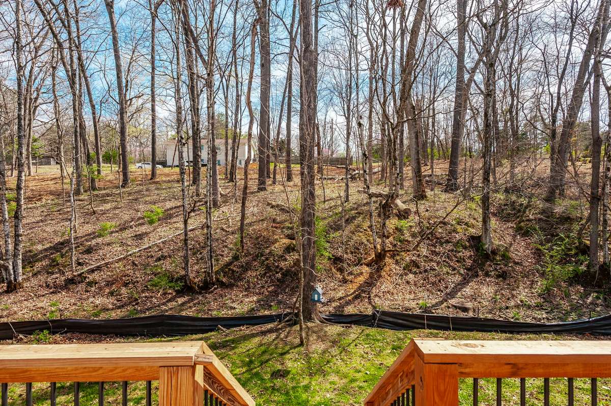 This lot also has one of the premier backyards in the community, with a flat area that backs up to a treed lot for a naturally peaceful and quiet space!