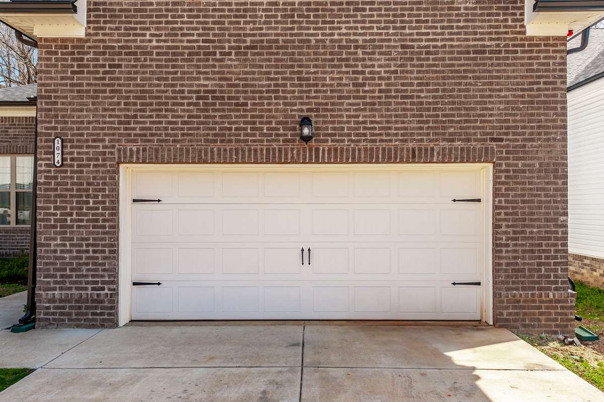 It comes with a full 2-car garage, perfect for vehicles or extra storage!