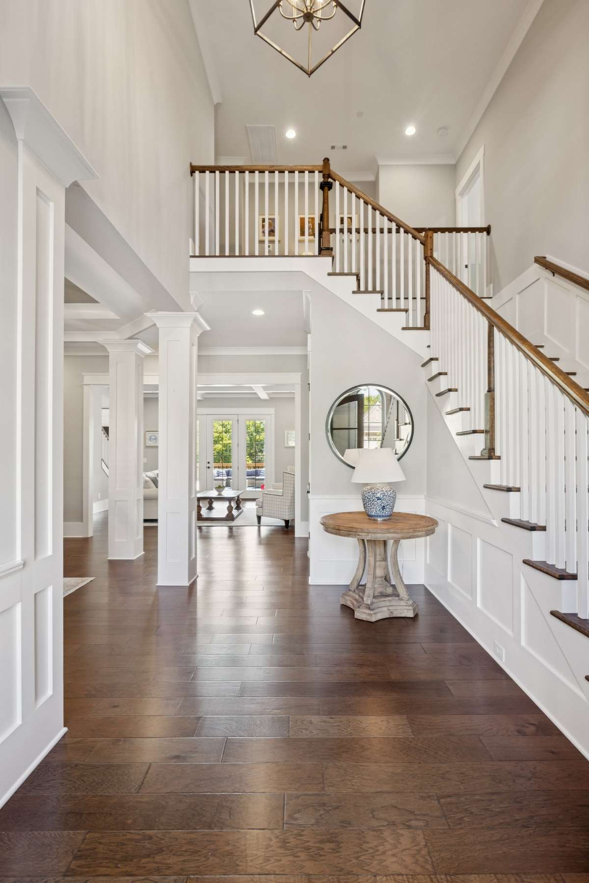 A grand entry welcomes you with soaring ceilings and refined architectural details, creating an immediate sense of warmth and sophistication.