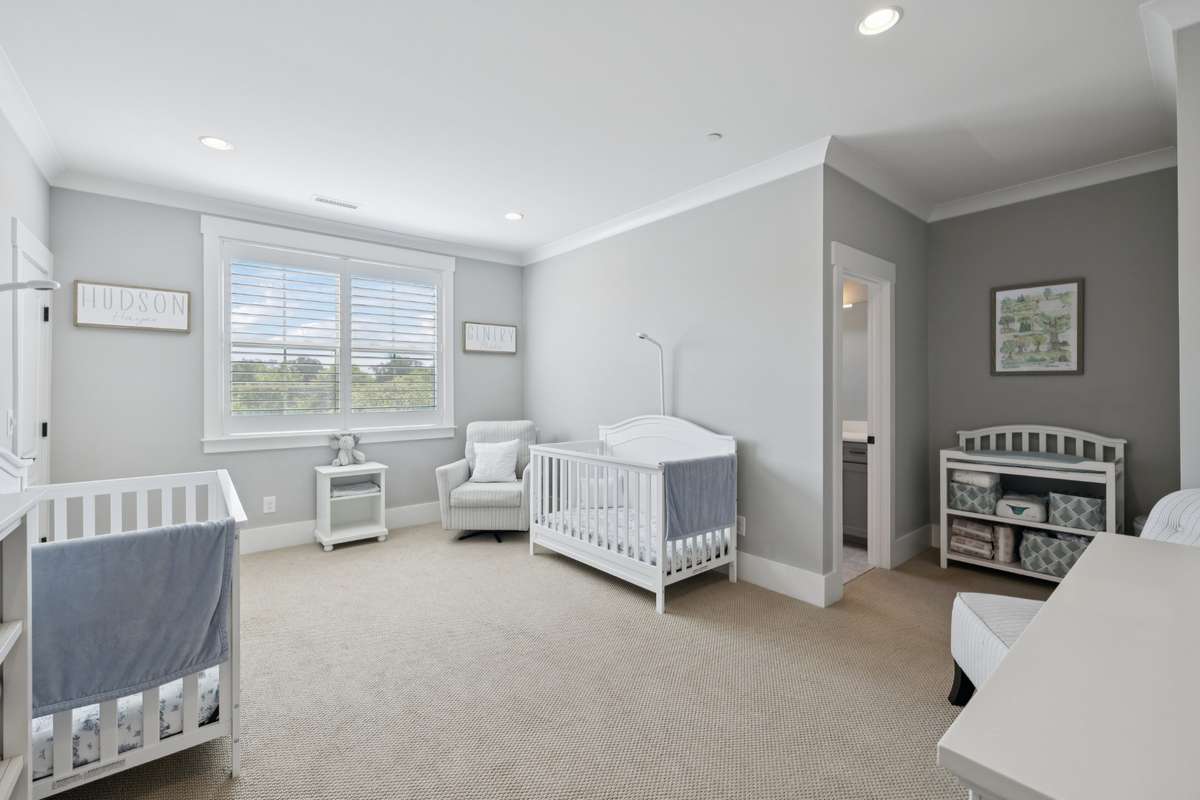 Upstairs, each additional bedroom includes its own en suite bath, while a generous bonus room provides flexible space for a media room, playroom, or fitness room.