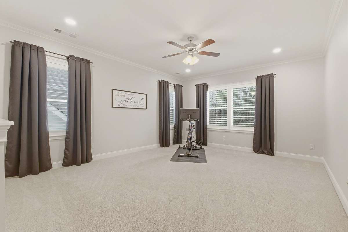 Upstairs loft area is perfectly sized for a billiard table, ping pong, or home exercise space.