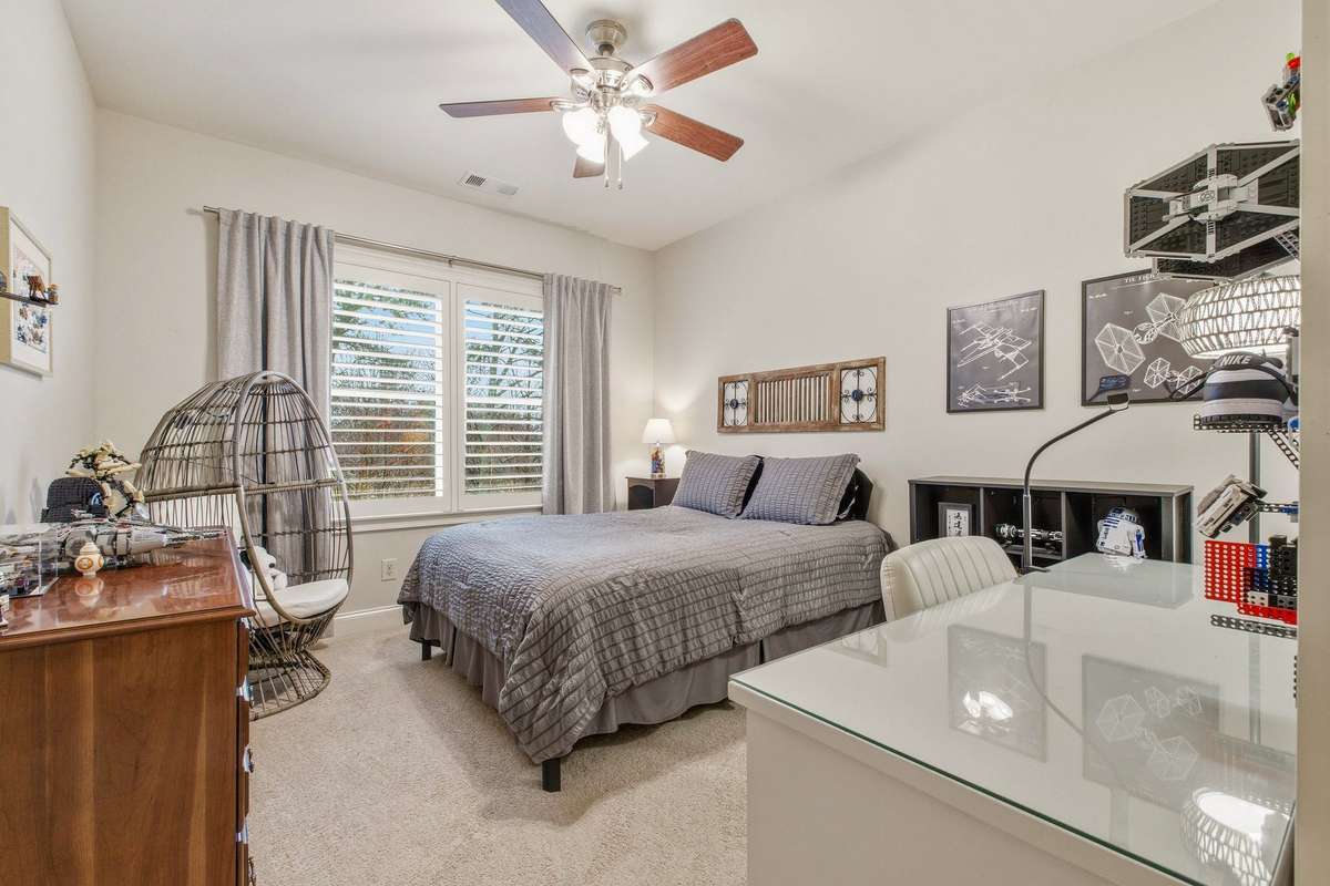 Third upstairs bedroom, on the back side of the house. Large walk-in closet. Jack-and-Jill bath directly across the hall.