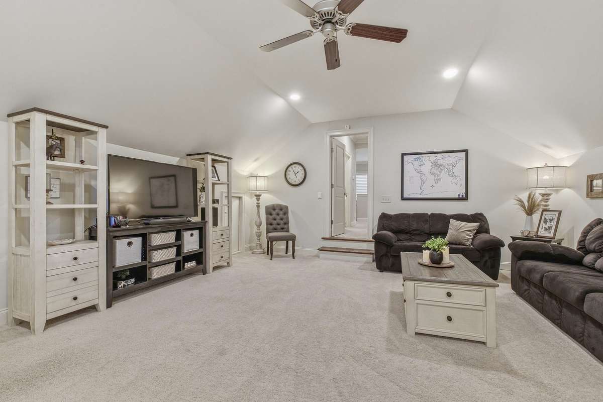 Bonus room has two knee-wall floored attic storage spaces.