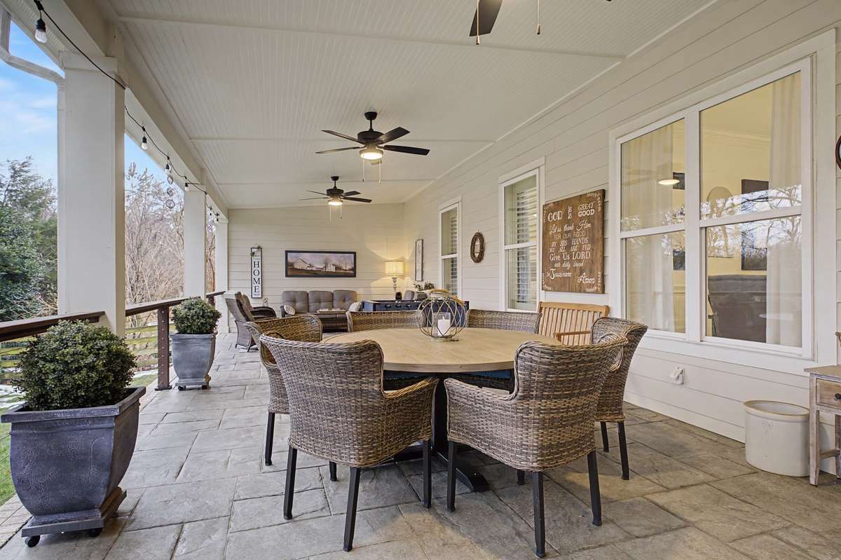 This incredible covered patio extends the full width of the home.