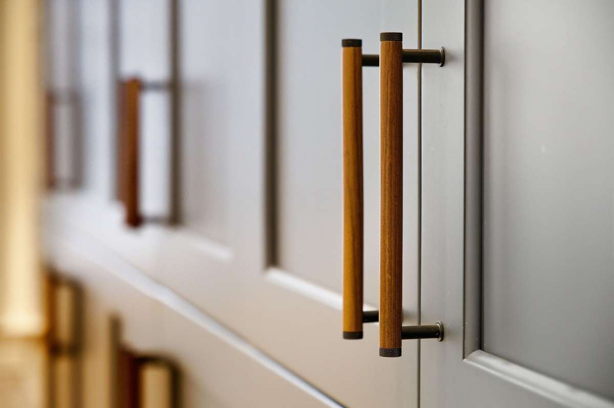 Boutique walnut accent pulls on the panty cabinets.