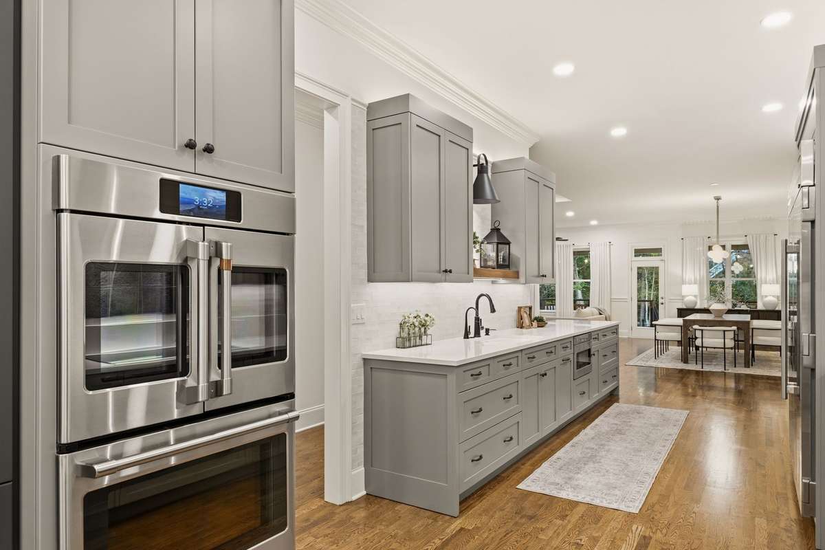 Commercial grade double oven. Custom accent lighting above and below all cabinets.
