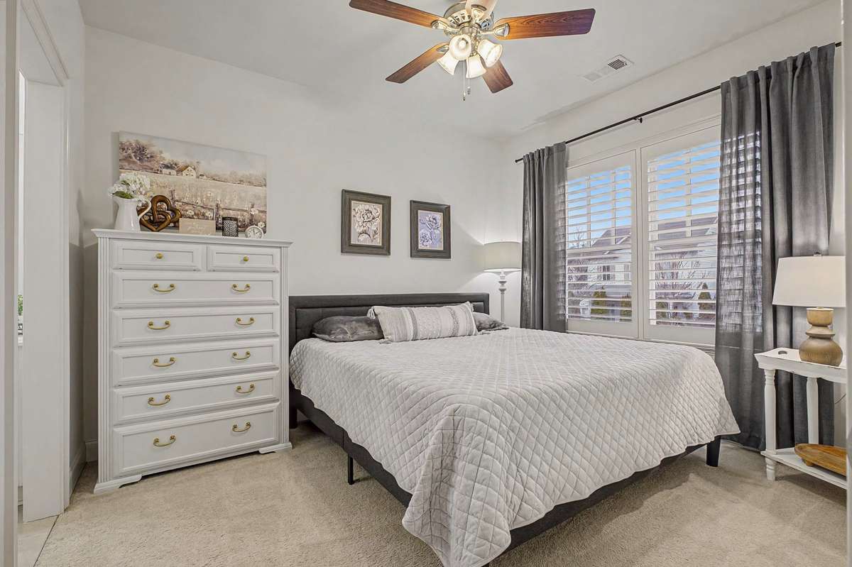 Second front upstair bedroom, direct access to jack-and-jill bath. Walk-in closet.