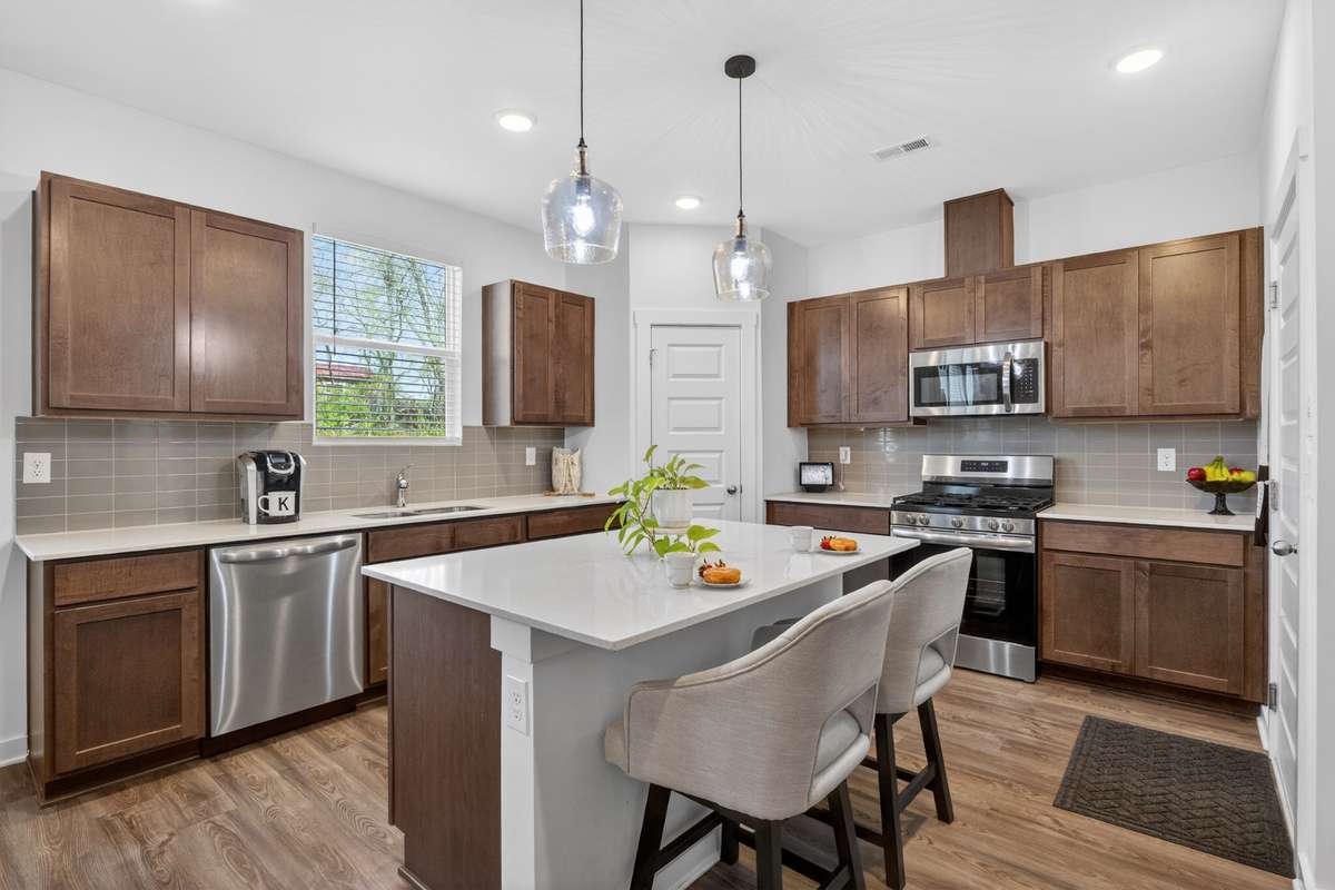A favorite - the window that overlooks the backyard! Get lost in your thoughts while staring into the large private backyard!  The cabinet space gives you room for all of your cookware and china! You will love the enormous pantry- it’s HUGE!