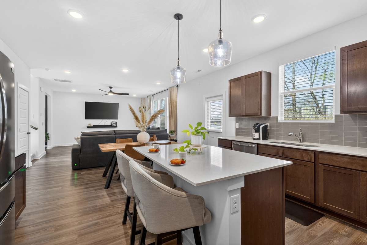 The kitchen island is a focal point in the home! Offering counter space and fun times!