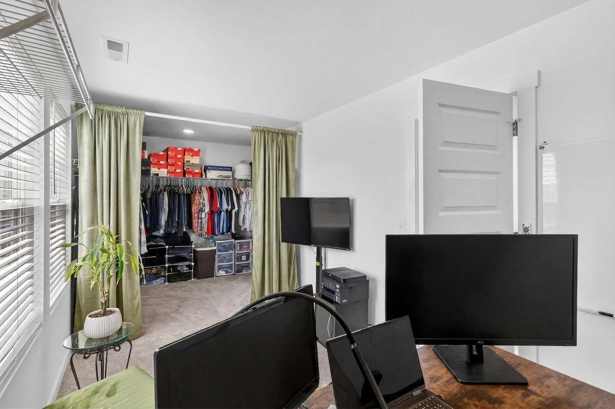 Currently using a portion of the closet as an office-
The closet is so big- there is not enough clothes to fill it!