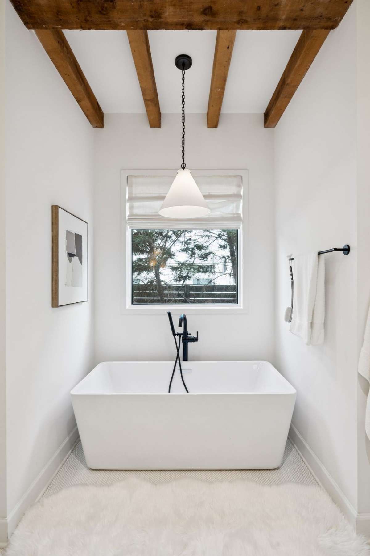 Luxurious primary bath featuring soaking tub and separate shower