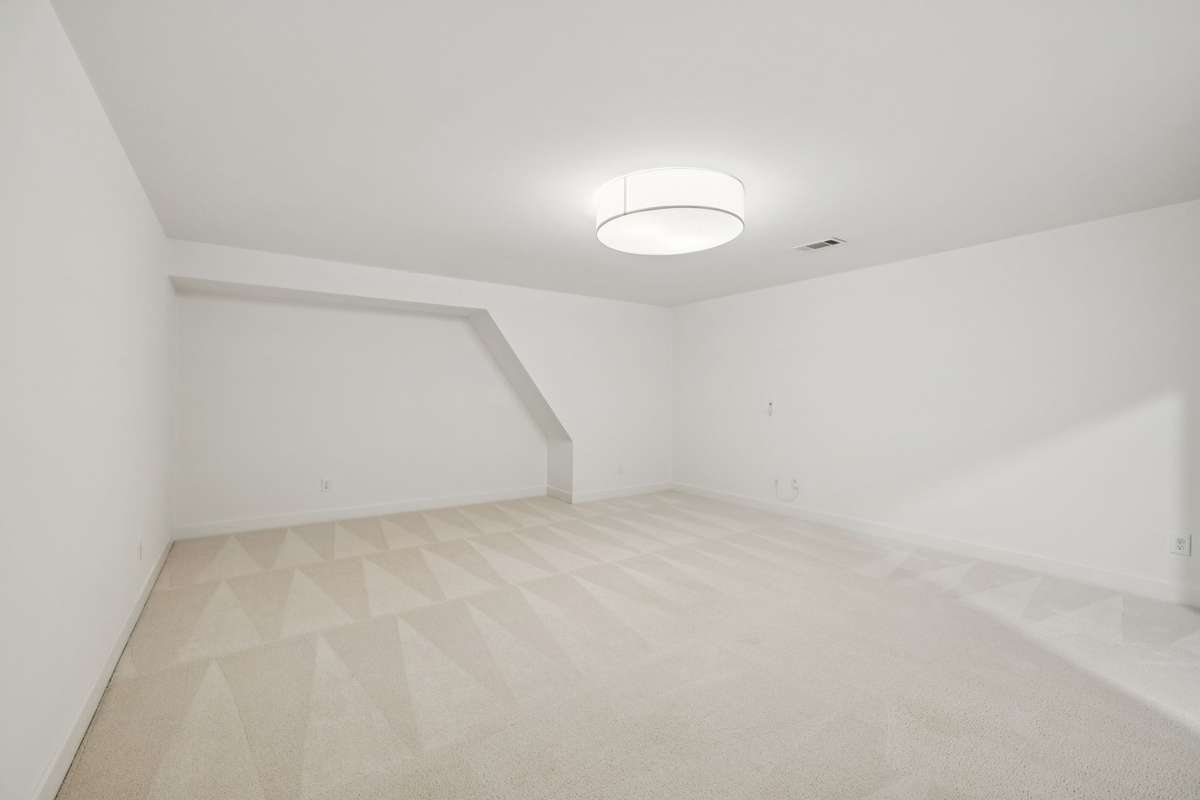 Oversized second-level media room with endless flexibility—ideal for a home theater, playroom, or additional lounge space.