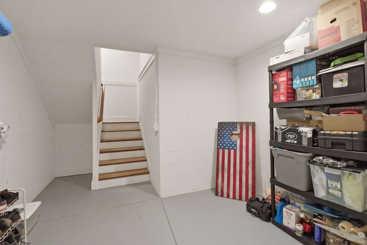 Storage room right as you walk in on the garage level and head up the stairs to the main level. This space is perfect to store all your extra items that only require occasional use.