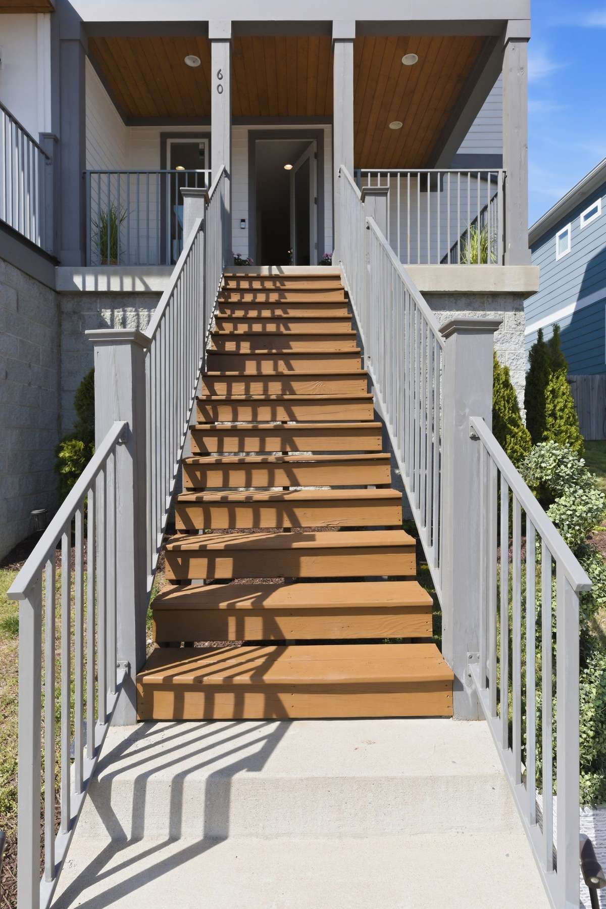 Your guests can enter the home through this elegant flight of stairs, while the owners use the convenient garage door access to the first floor.