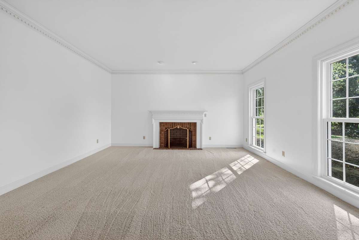 Formal living space with a beautiful fireplace.