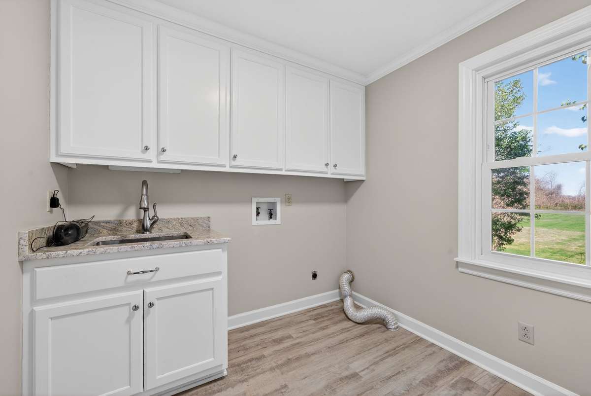 Upstairs laundry makes putting away clothes easy and convenient.
