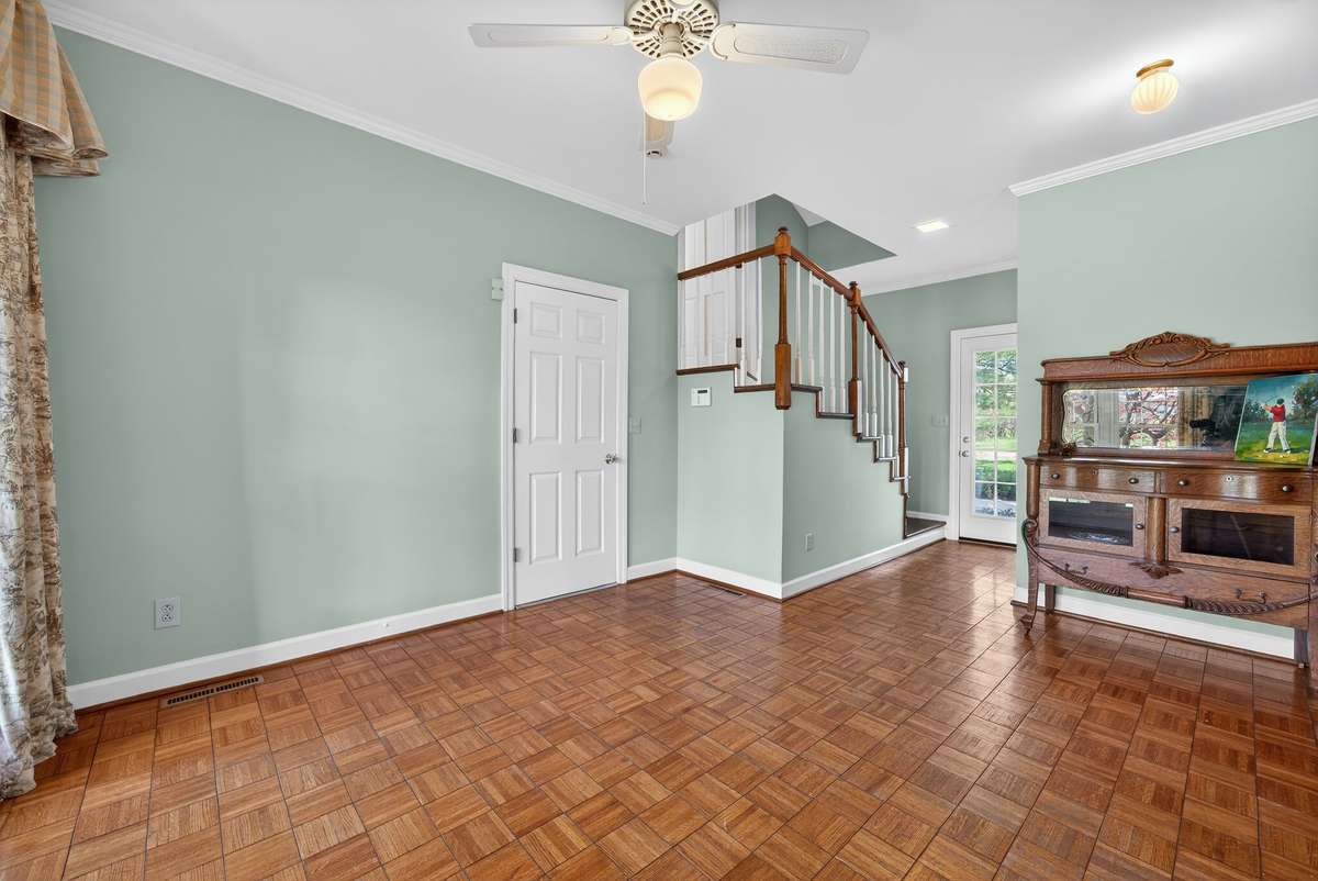 Beautifully versatile, the sunroom also serves as an ideal drop zone near the rear entry.